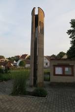 https://upload.wikimedia.org/wikipedia/commons/thumb/7/77/Bell_tower_in_Kostn%C3%ADky%2C_T%C5%99eb%C3%AD%C4%8D_District.JPG/800px-Bell_tower_in_Kostn%C3%ADky%2C_T%C5%99eb%C3%AD%C4%8D_District.JPG