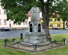 https://upload.wikimedia.org/wikipedia/commons/thumb/9/96/Ves_Tou%C5%A1kov%2C_memorial.jpg/1024px-Ves_Tou%C5%A1kov%2C_memorial.jpg